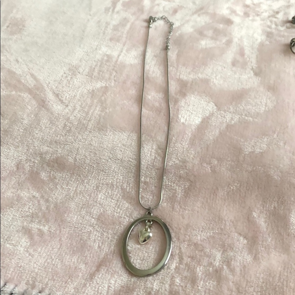 Silver necklace with heart in middle